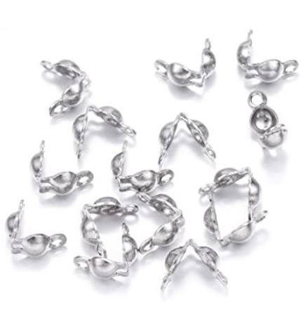White metal bead tips for jewelry making, used to conceal knot ends and connect strands